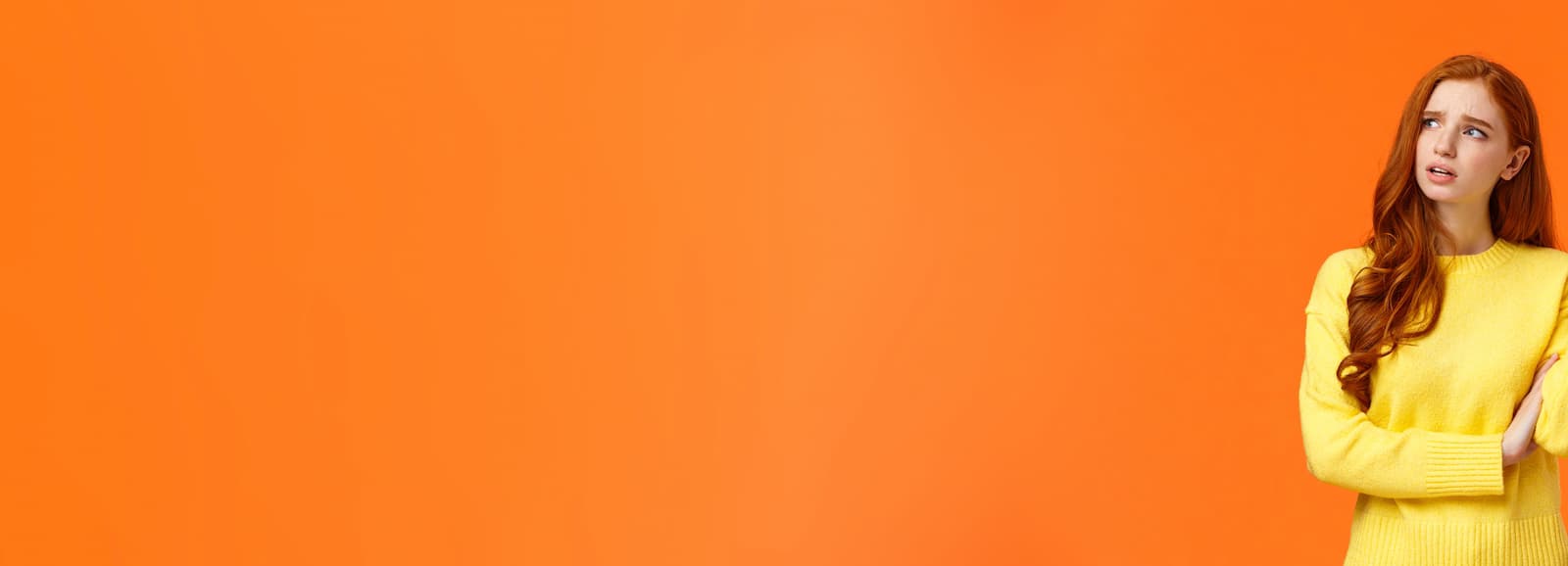 Woman on an orange background next to the text ‘Have questions or need assistance?’