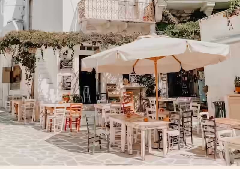 Traditional Cycladic tower mansion and narrow alley in the historic village of Halki, Naxos island, Greece
