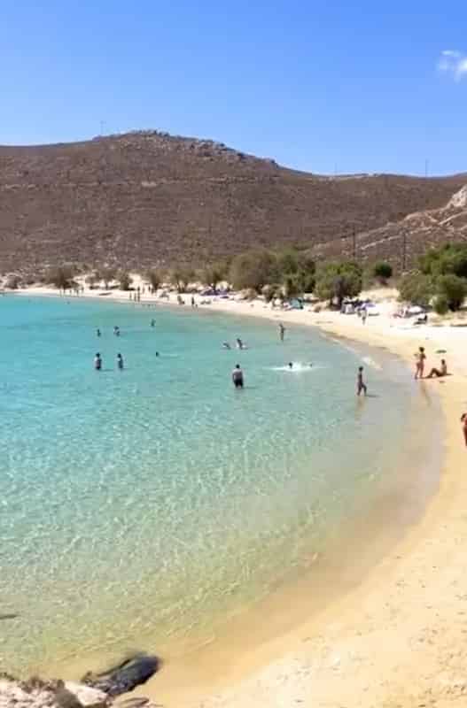 Panoramic view of the golden sandy Psili Ammos beach on Samos with crystal clear waters.